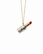 Load image into Gallery viewer, Lipstick-shaped pendant on a gold chain against a white background