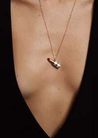 Model wearing the Colette lab-grown pendant in yellow gold