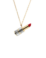 Lipstick-shaped pendant on a gold chain against a white background