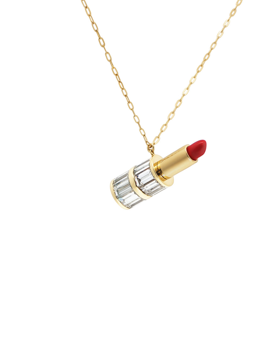 Lipstick-shaped pendant on a gold chain against a white background