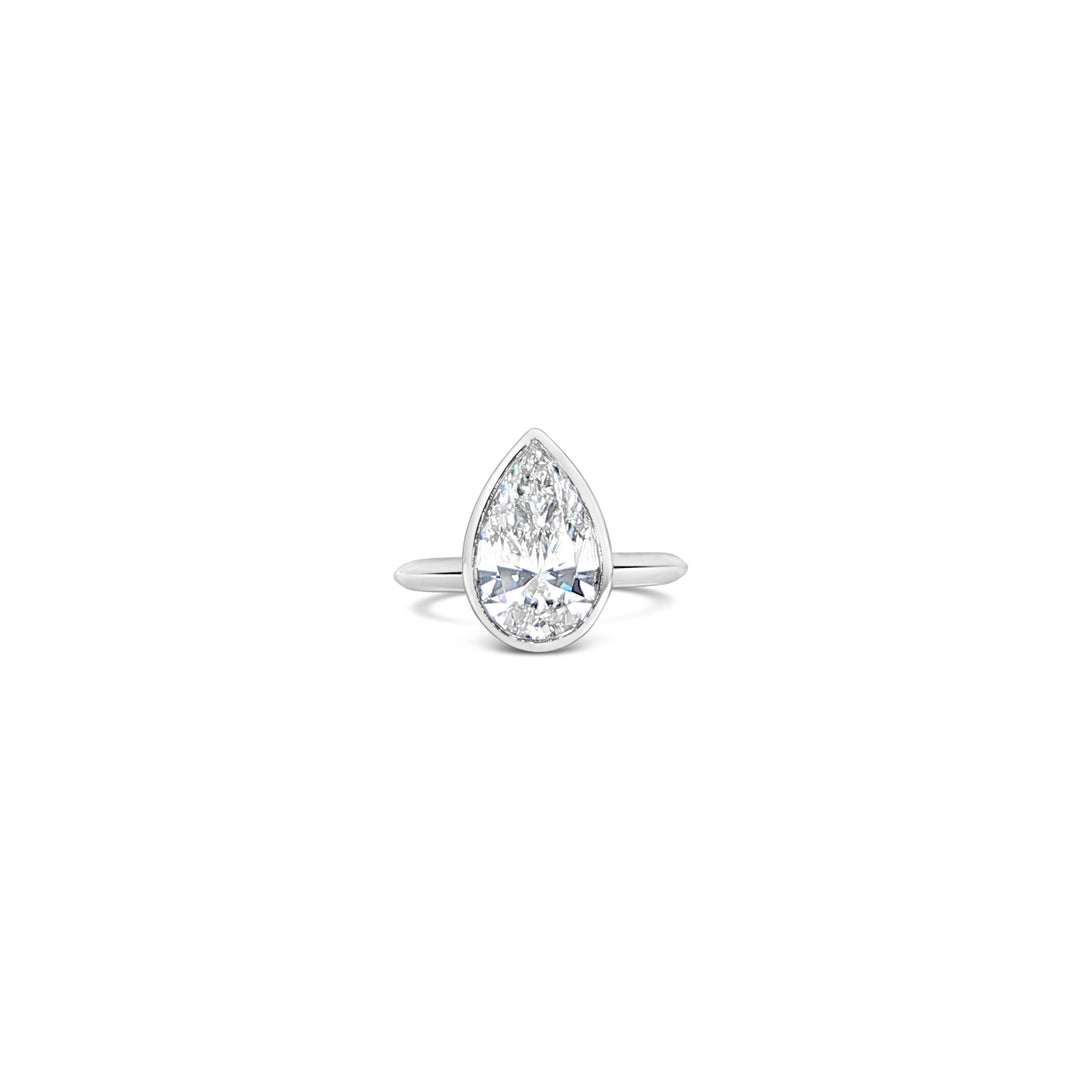 Les Pinky Collection pear cut lab grown diamond ring in bezel setting and platinum by Victoire
