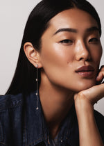 Load image into Gallery viewer, Model wearing Sequence collection long earrings with lab grown diamonds on white gold chain by Victoire